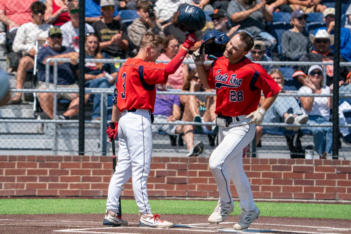 Bear Cubs' left fielder Shane Moran bumps helmets with teammate, Tyler Nordyke after hitting a homer in the top of the fourth inning during game two of the 3C2A Regional Finals on Saturday, May 17, 2025 in Santa Rosa. 