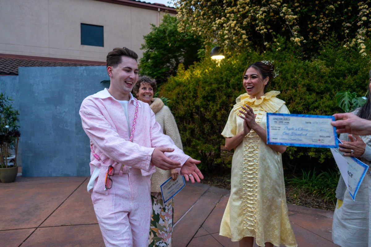 Henrik Gutt takes center stage to claim his $100 reward for winning the people's choice award during the Santa Rosa Junior College's 2025 Spring Fashion Show at the SRJC Petaluma Campus on Thursday, May 1, 2025.