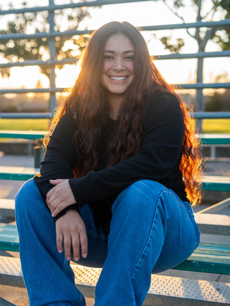 Gabby Schenone sits in the bleachers of Magnolia Park where her and her family spent years watching Schenone play on January 28, 2025 in Rohnert Park, California.