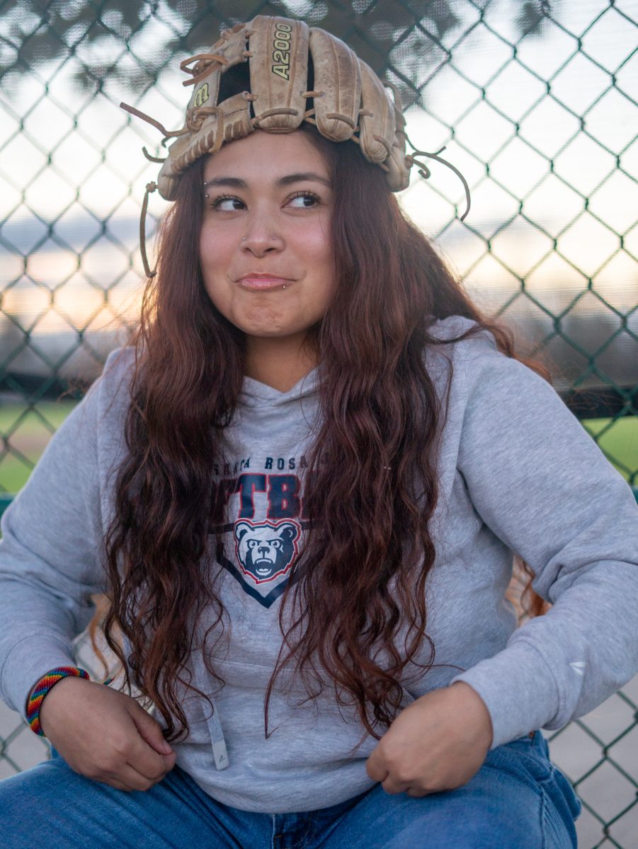 Gabby Schenone gets silly in the dugout at Magnolia Park on Jan. 28 in Rohnert Park, California.