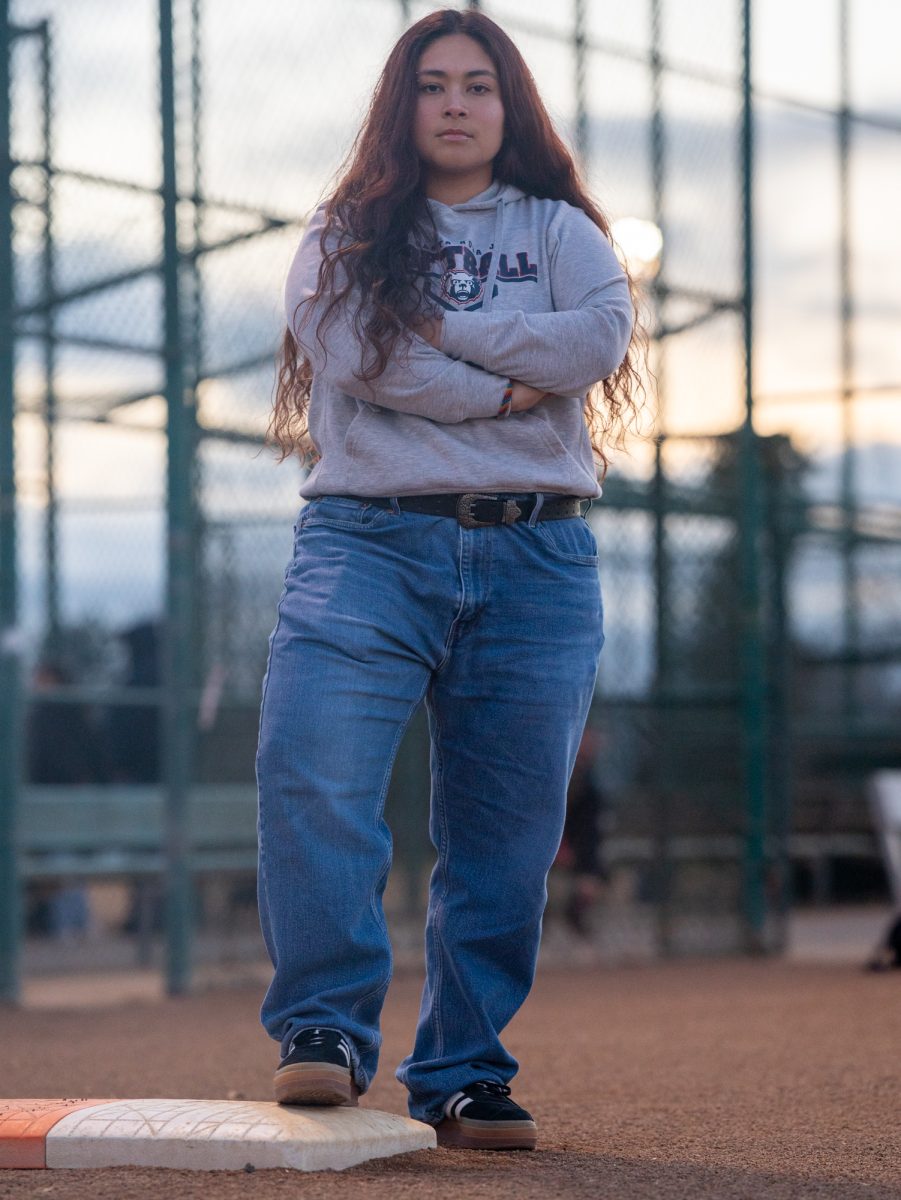 Gabby Schenone steps on first base on at the Magnolia Park softball field on Jan. 28 in Rohnert Park, California.