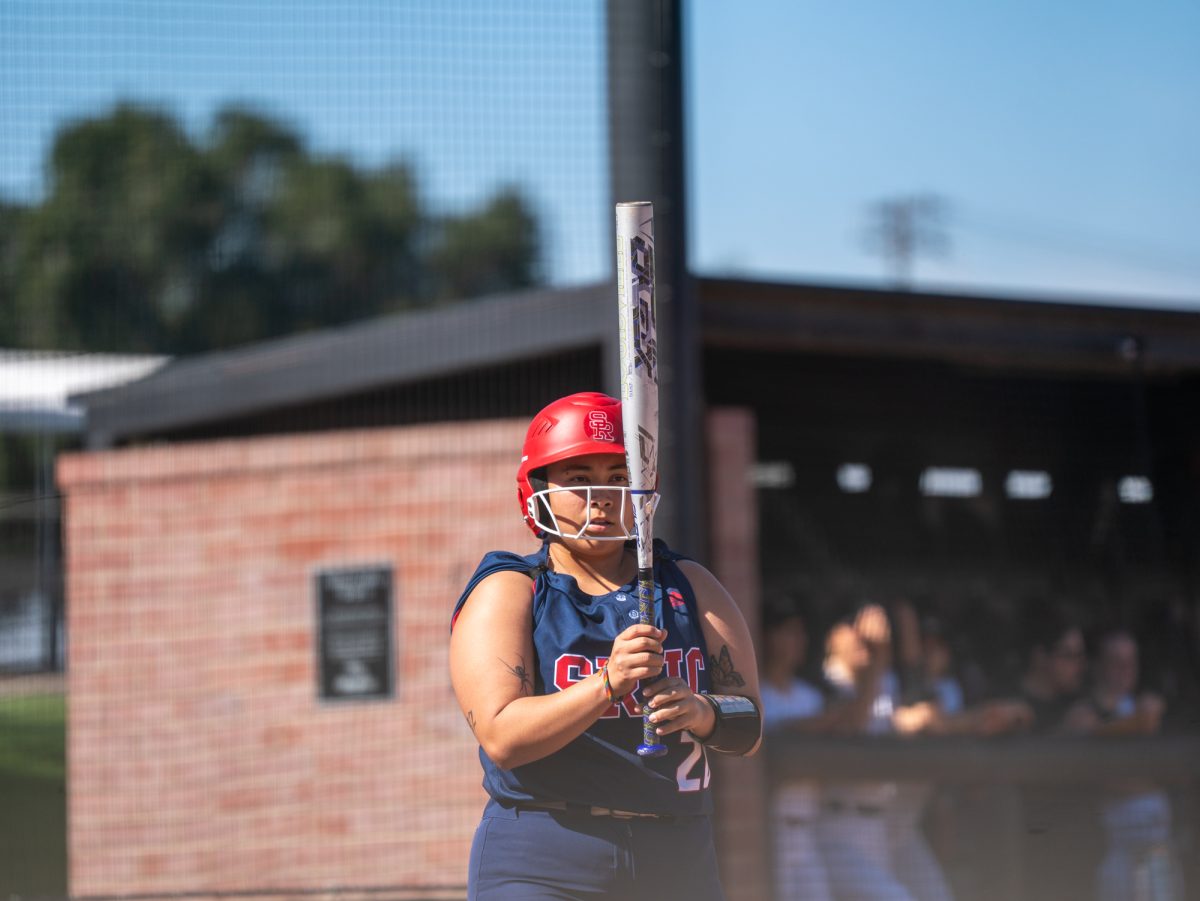 Sophomore third baseman Gabby Schenone prepares to bat against San Joaquin Delta on the Bill Simoni softball field on Feb. 22 in Stockton, California.