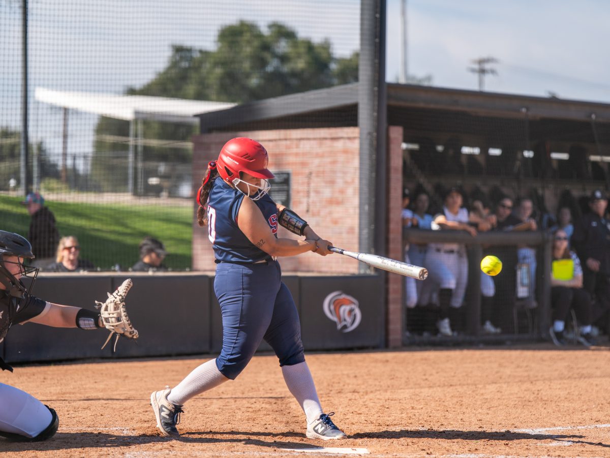 Sophomore second baseman Gabby Schenone hits a double to left field in the bottom of the fifth against San Joaquin Delta on the Bill Simoni softball field on Feb. 22 in Stockton, California.
