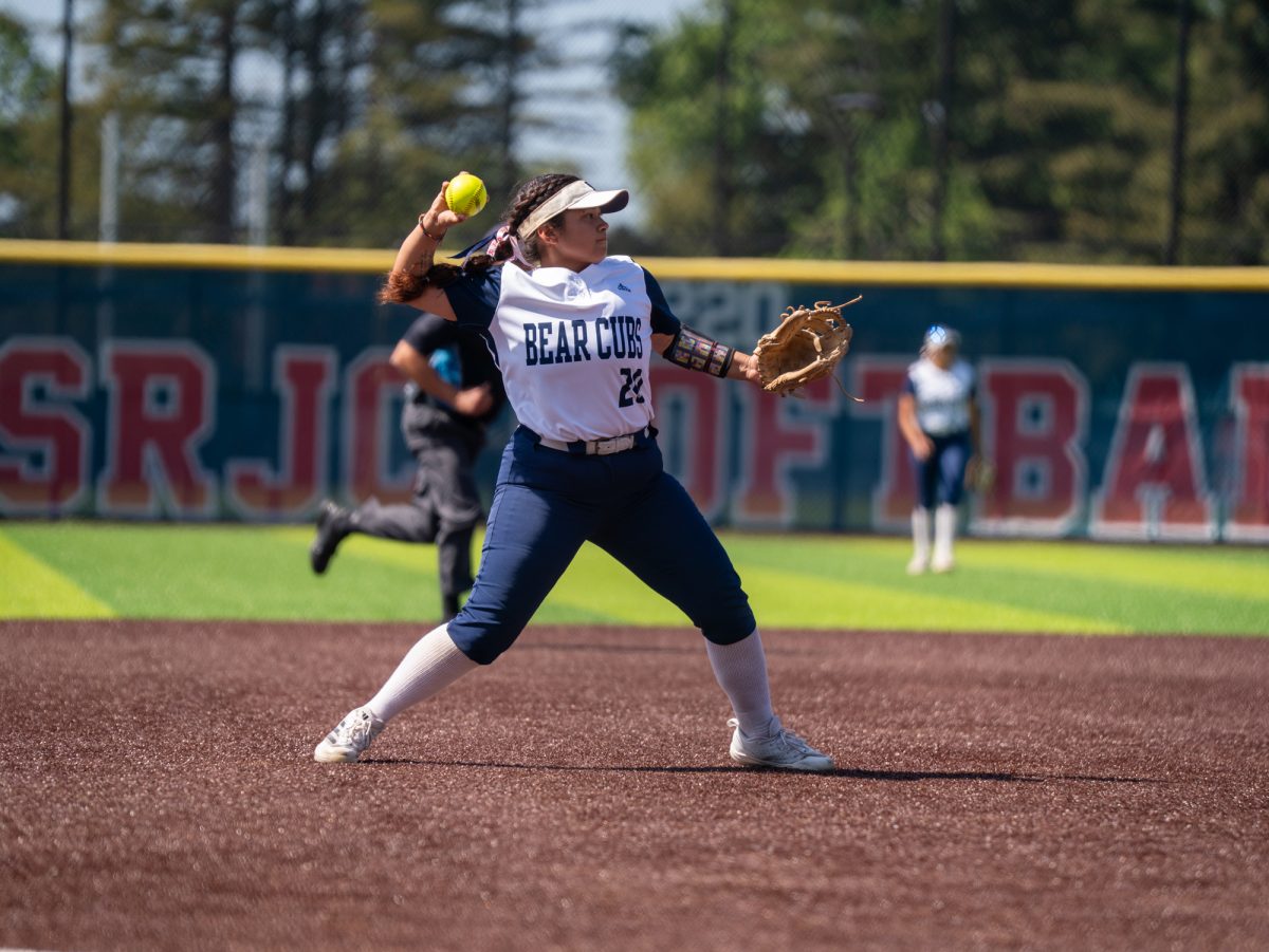 Sophomore third baseman Gabby Schenone sends the ball towards second base during the game against Cosumnes River College on Sophomore Day on Tuesday, April 22 at home.