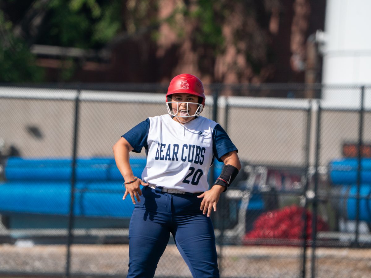 Sophomore third baseman Gabby Schenone celebrates at first base after a single to right field sends freshman Kylee Baumann home for an RBI in the bottom of the fifth against Cosumnes River College on Sophomore Day on Tuesday, April 22 at home.