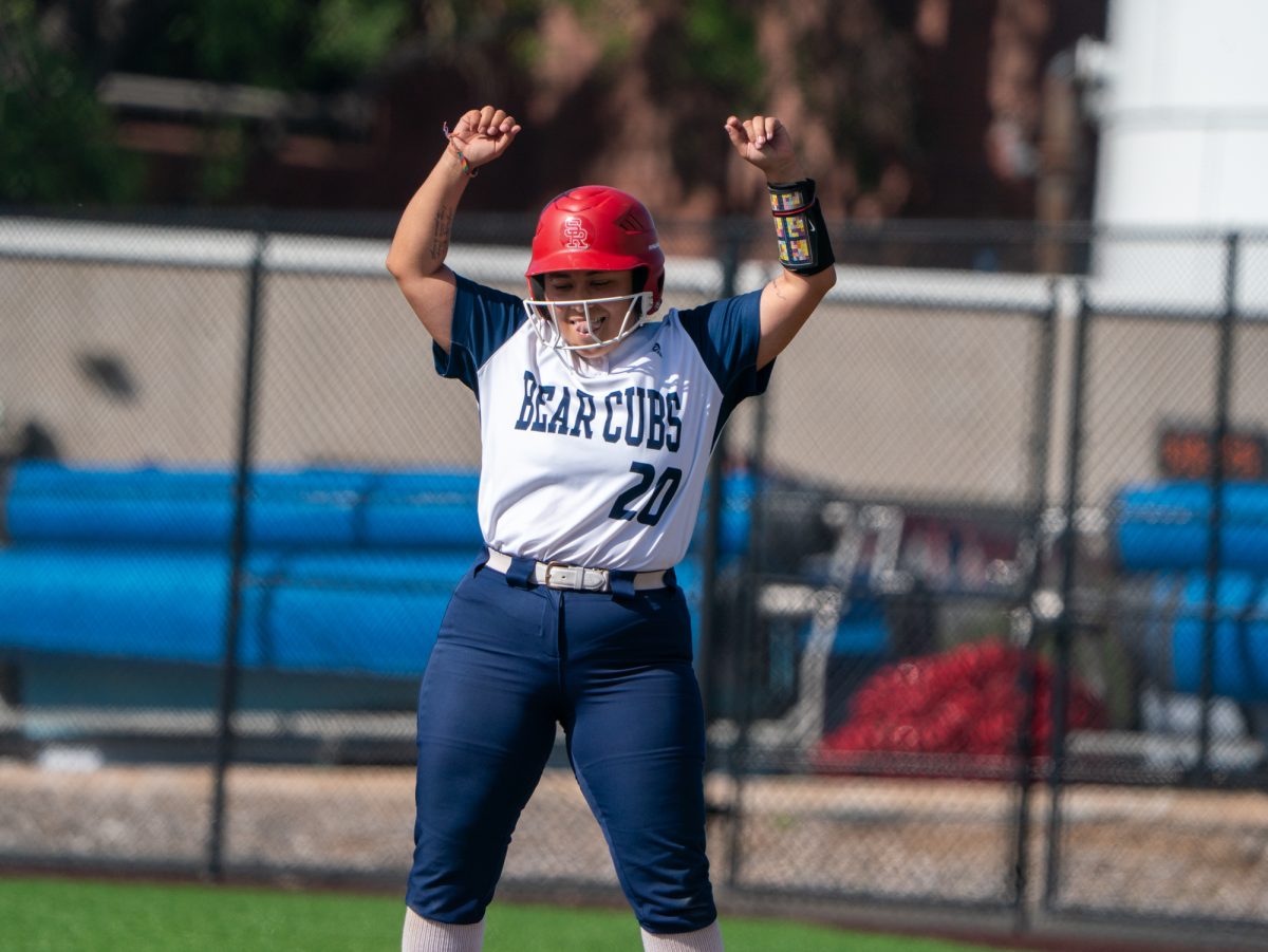 Sophomore third baseman Gabby Schenone celebrates at first base after a single to right field sends freshman Kylee Baumann home for an RBI in the bottom of the fifth against Cosumnes River College on Sophomore Day on Tuesday, April 22 at home.