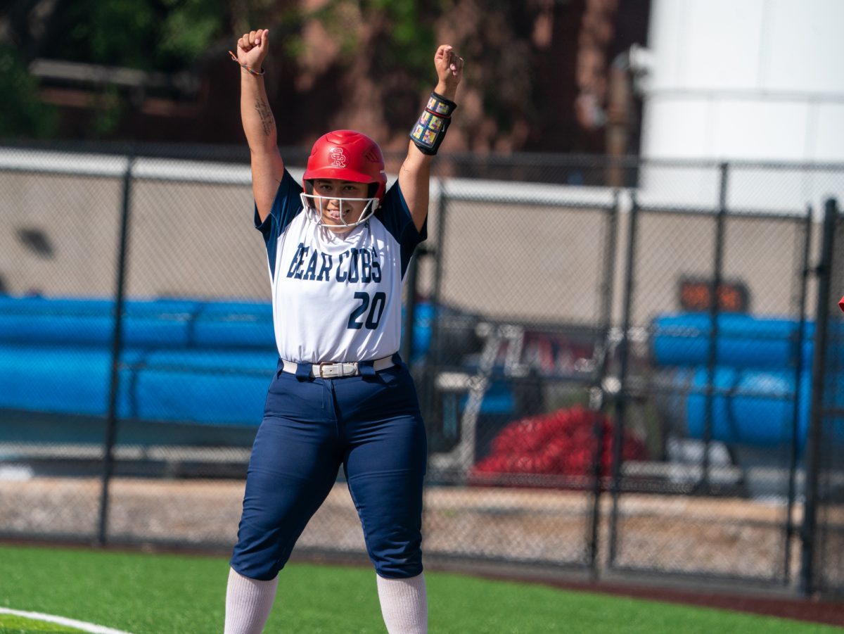 Sophomore third baseman Gabby Schenone celebrates at first base after a single to right field sends freshman Kylee Baumann home for an RBI in the bottom of the fifth against Cosumnes River College on Sophomore Day on Tuesday, April 22 at home.
