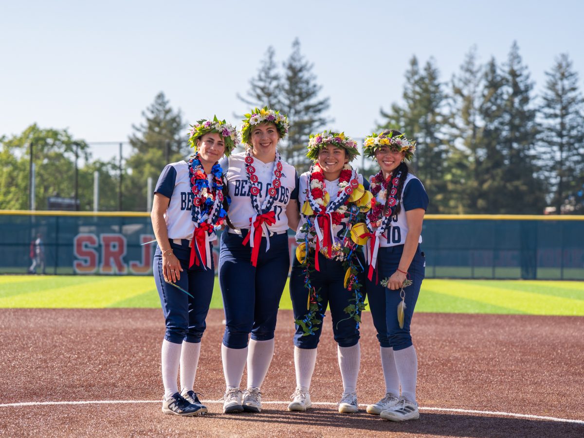 From left to right, sophomores Kali Garcia, Sofia Uricoechea, Gabby Schenone and Kayla Ling stand at the pitching mound together for one final time on Sophomore Day on Tuesday, April 22 at home.