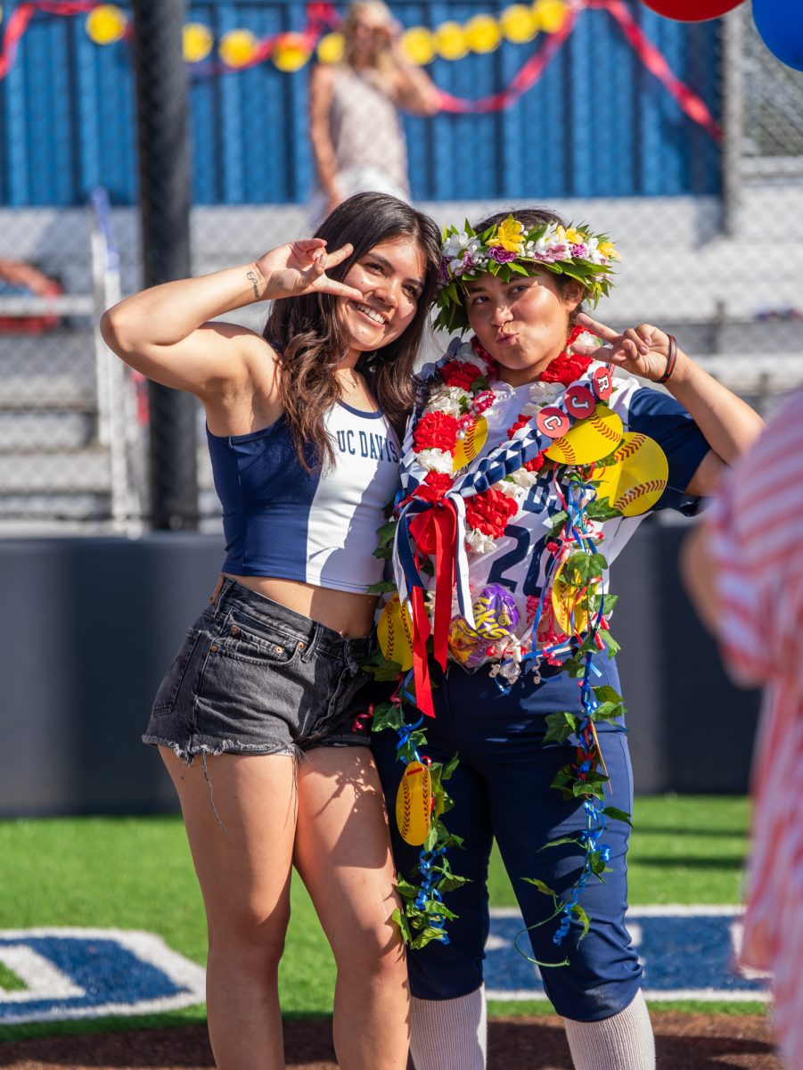 From left to right, former Bear Cub Nataya Brown poses with sophomore Gabby Schenone after the game on Sophomore Day on Tuesday, April 22 at home.