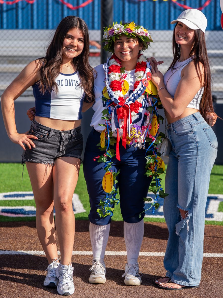 From left to right, former Bear Cubs Nataya Brown and Hailey Martin show their support for sophomore Gabby Schenone, center, on Sophomore Day on Tuesday, April 22 at home.