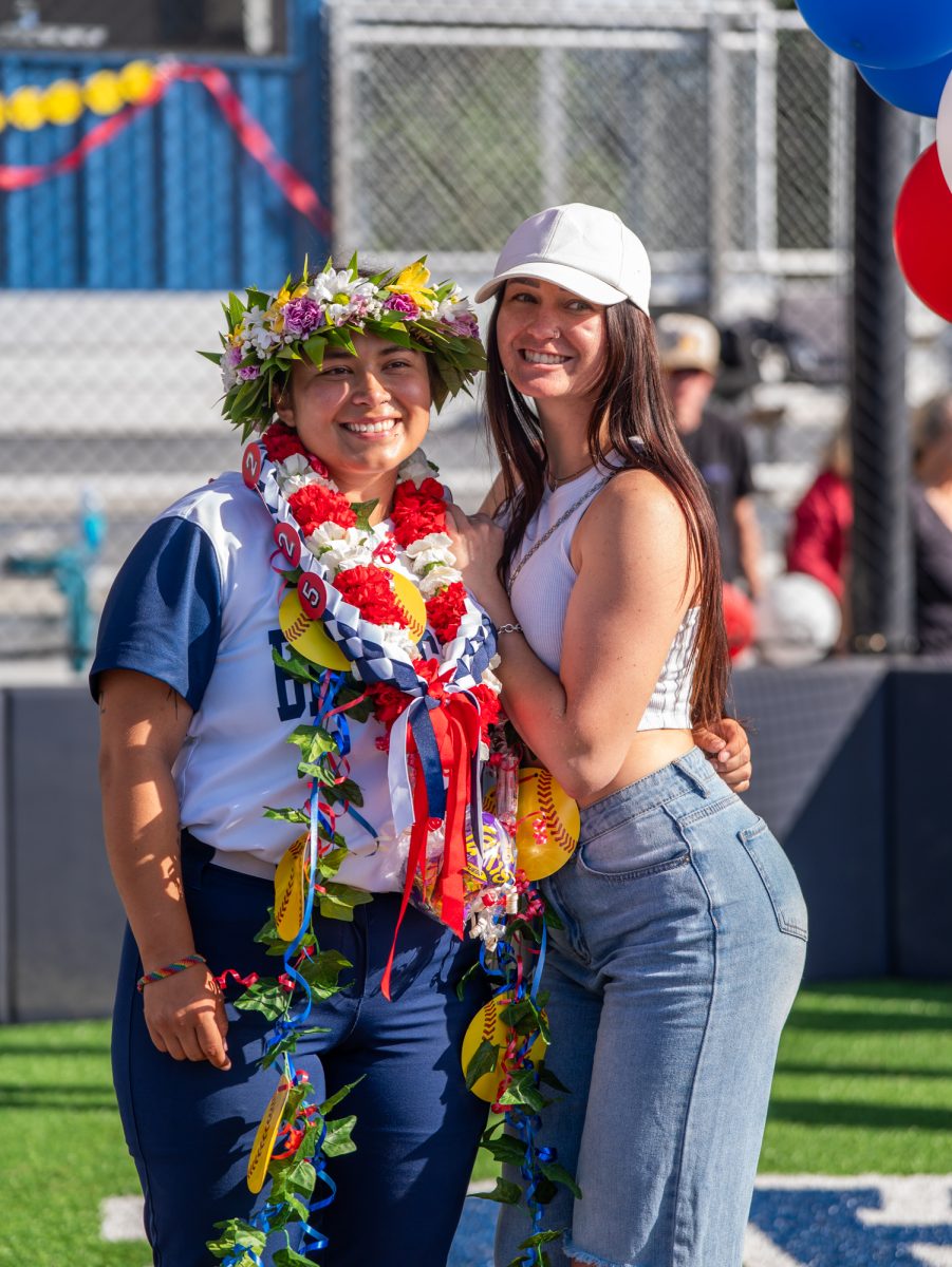 From right to left, former Bear Cub Hailey Martin visits sophomore Gabby Schenone to support her for her final home game on Sophomore Day on Tuesday, April 22 at home.