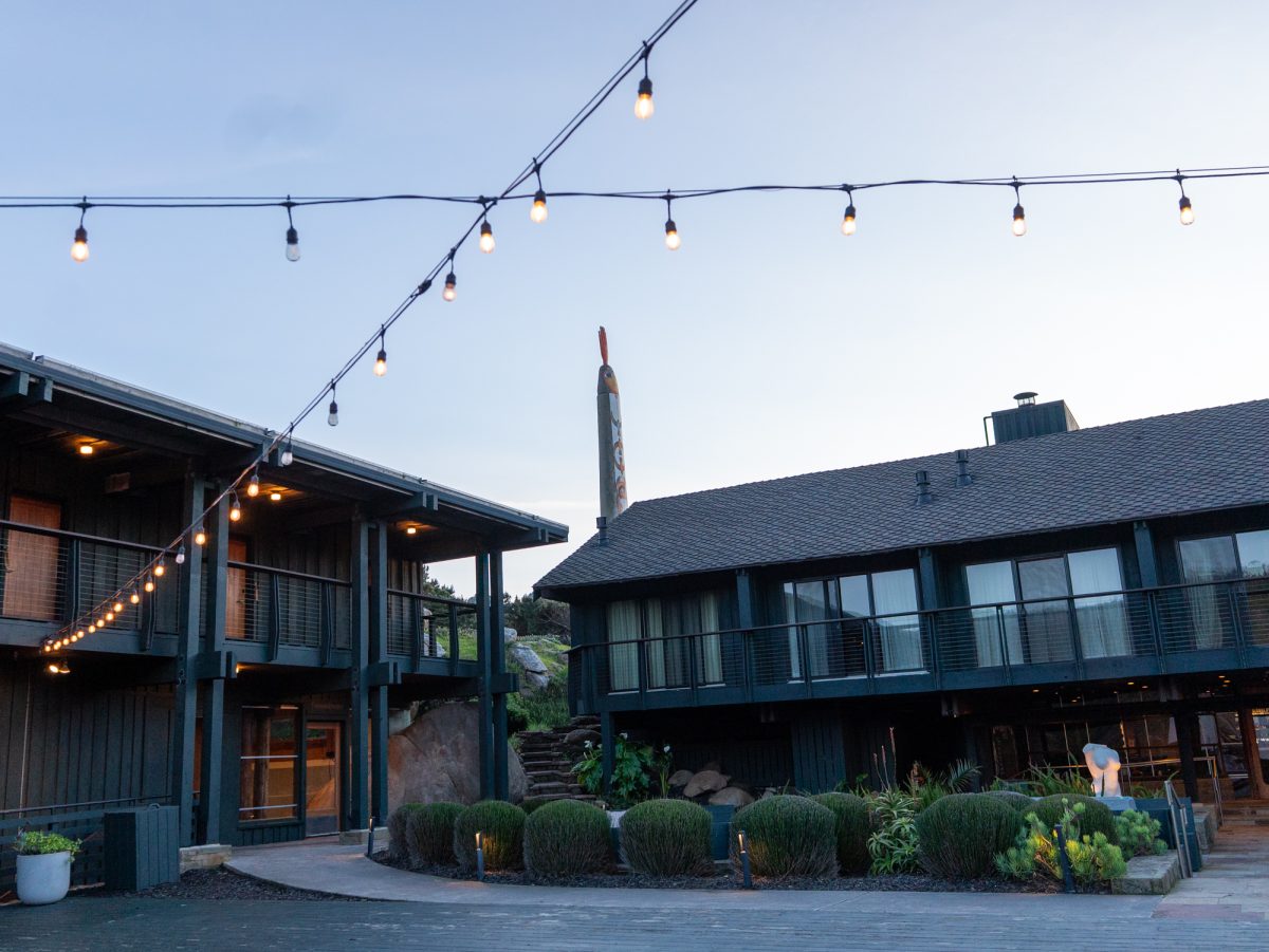 Market lights hang above the courtyard of Timber Cove Resort where guests can access the gym, main lobby, restaurant and additional hotel rooms in Jenner, California. 
