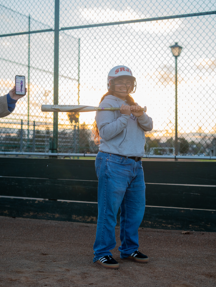 SRJC sophomore Gabby Schenone replicates an old T-ball photo that her mom Kristina found at Magnolia Park on Jan 28, 2025 in Rohnert Park, California.