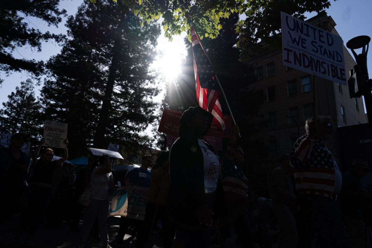 Protestors march around downtown Santa Rosa on Wednesday, June 11, 2025. The protest formed at the center of the weekly Santa Rosa Night Market and comes after days of ICE, the National Guard, and LAPD being present in the greater Los Angeles region.