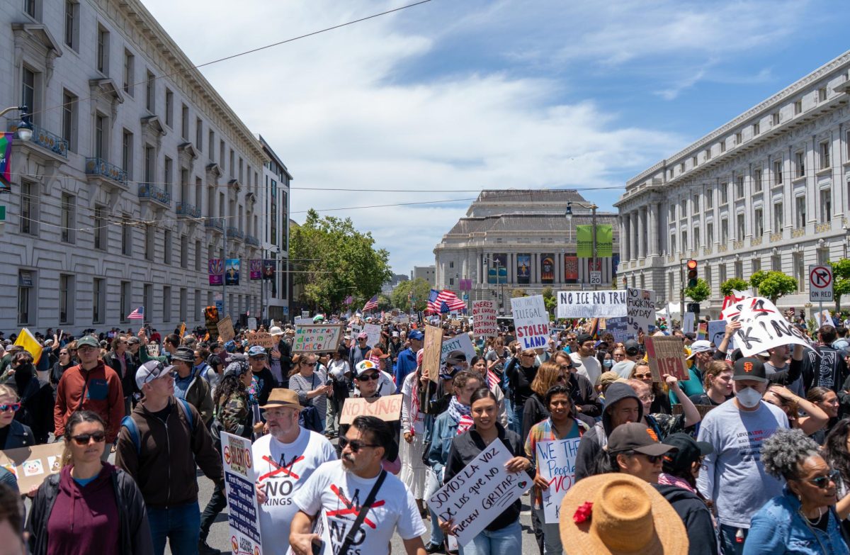 Protesters march on Mission Street from Dolores Park to Civic Center Plaza for "No Kings Day" on Saturday, June 14, 2025 in San Francisco.