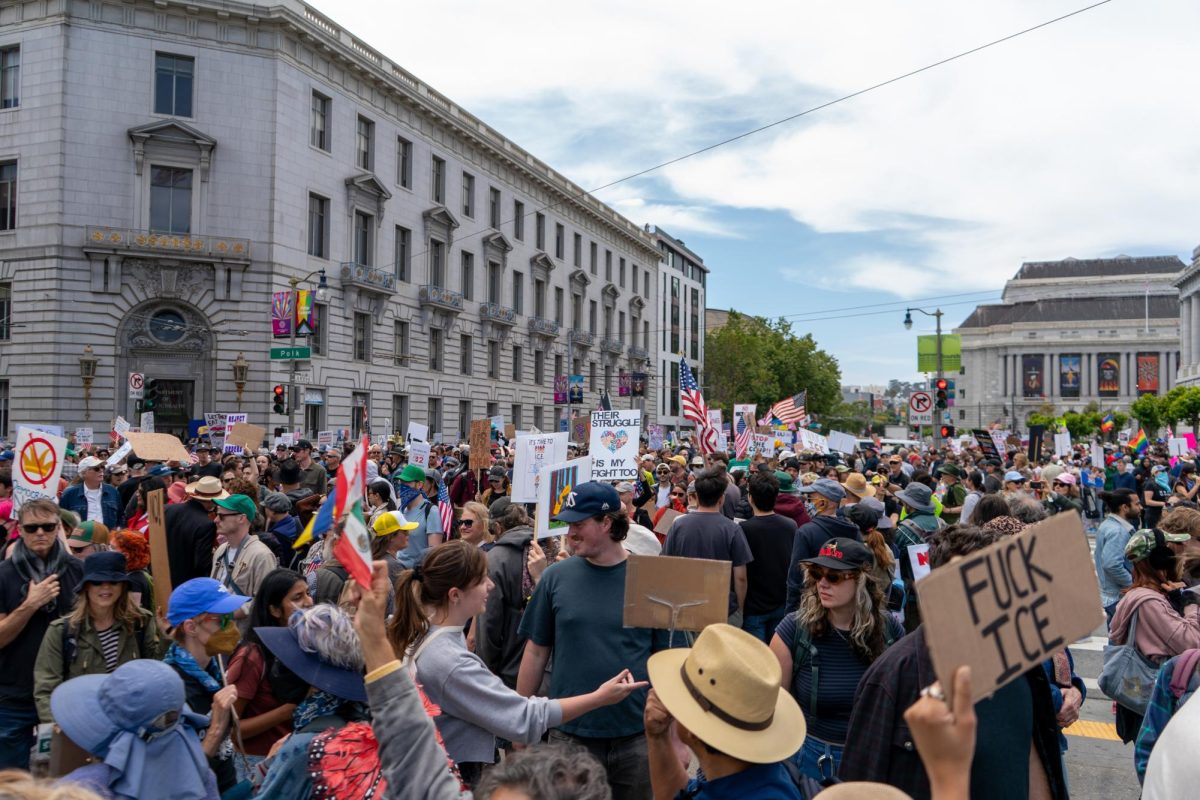 Protesters march on Mission Street from Dolores Park to Civic Center Plaza for "No Kings Day" on Saturday, June 14, 2025 in San Francisco.