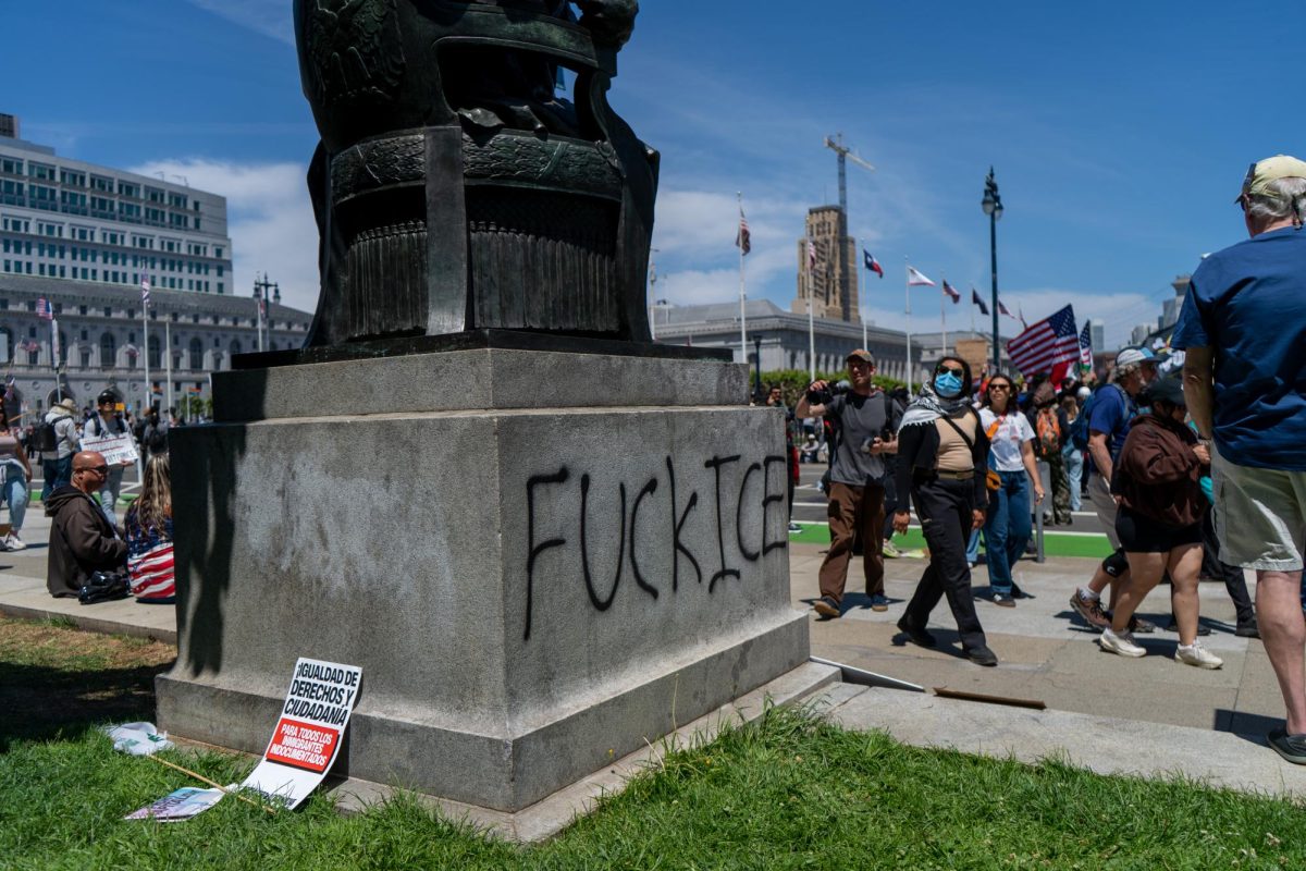 The base of a statue of Abraham Lincoln in Civic Center Plaza is graffitied with "FUCK ICE" at "No Kings Day" on Saturday, June 14, 2025 in San Francisco.