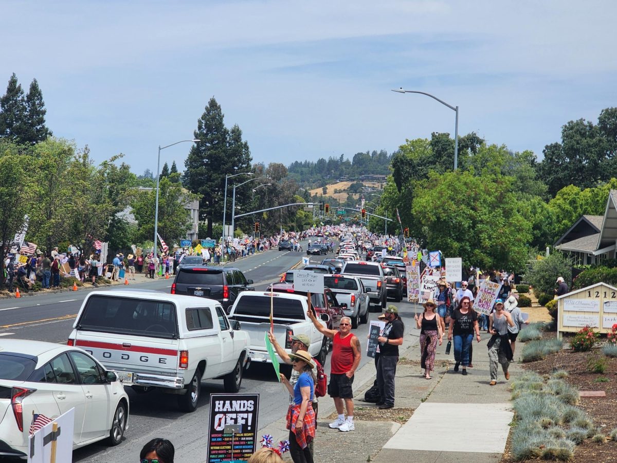 While a main procession of peaceful protestors marched up and down Farmers Lane, other protestors lined the street and waved signs at passing cars.