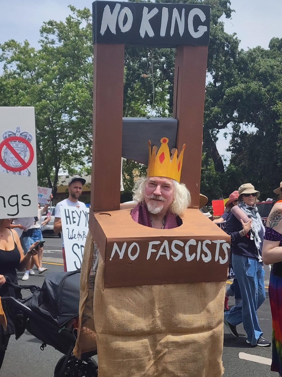 Protestors march down Farmers Lane towards Hoen Avenue on June 14  to share their disdain for the Trump administration and the president's apparent over-reach of influence in the government.