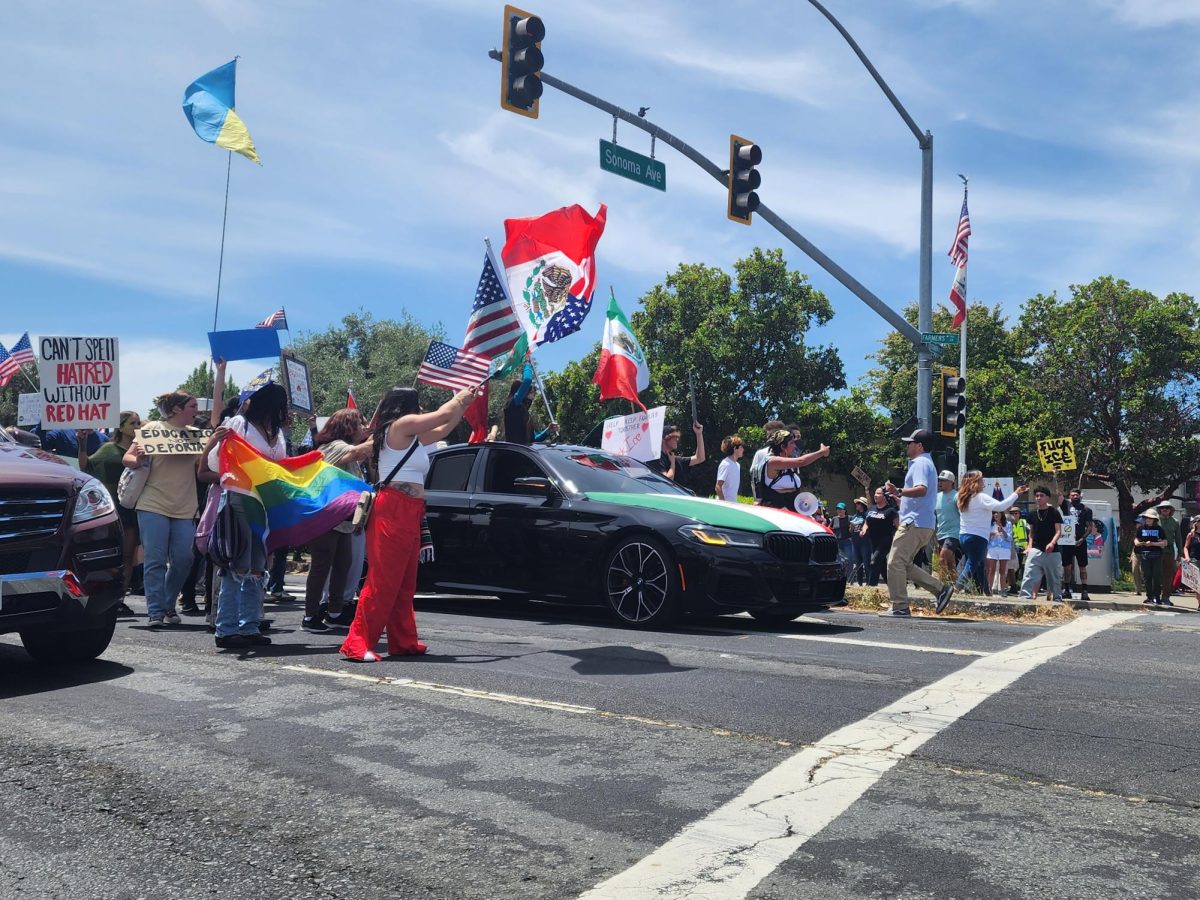 Protestors march down Farmers Lane towards Hoen Avenue on June 14  to share their disdain for the Trump administration and the president's apparent over-reach of influence in the government.