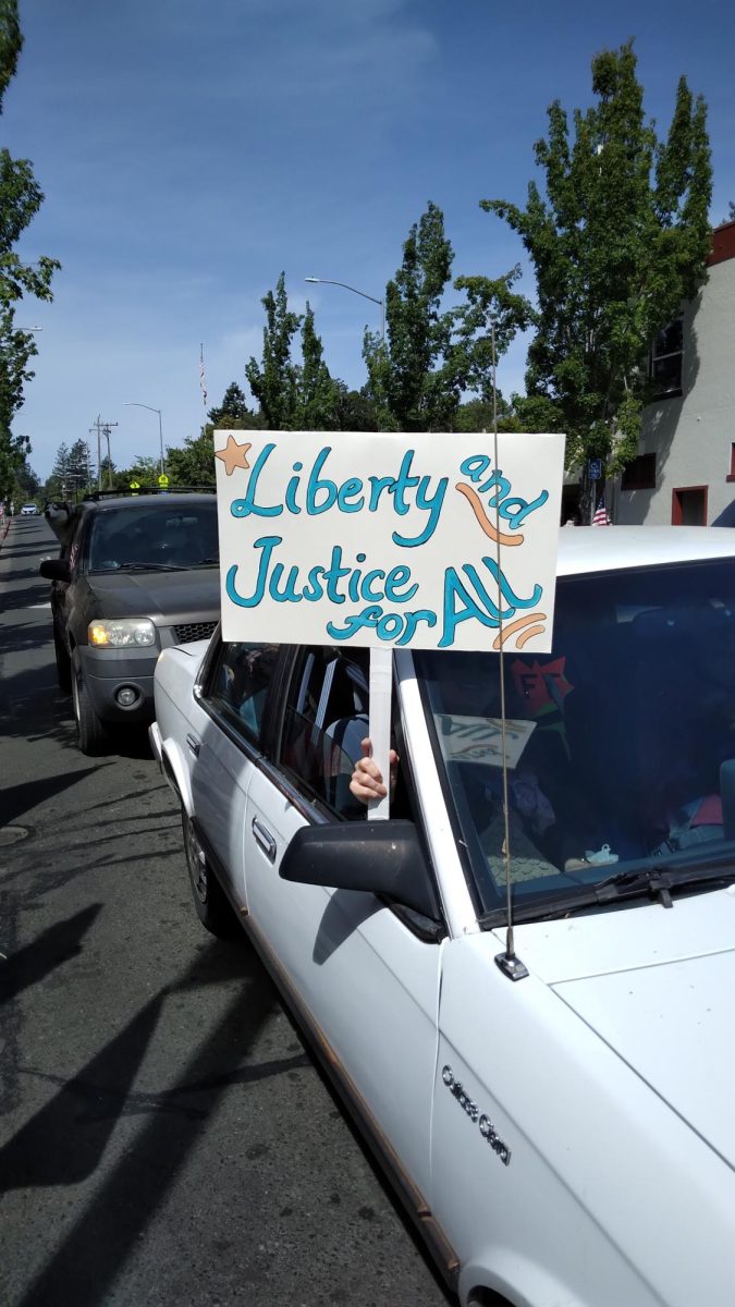 Cars drove through downtown Sebastopol displaying their own signs as part of the No Kings protest in Sebastopol on June 14, 2025.