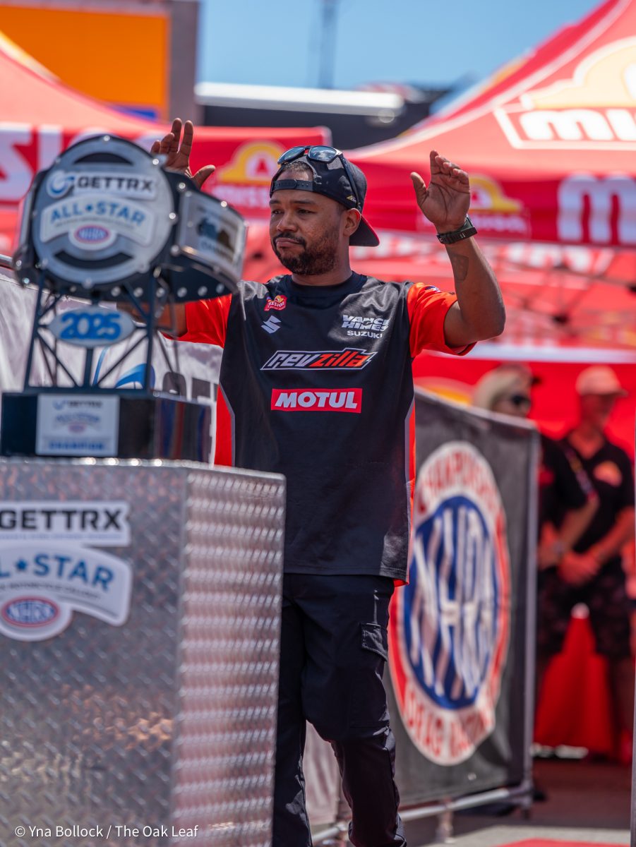 Pro Stock Motorcyle driver Richard Gadson waves to the crowd as he enters the GETTRX All Start Pro Stock Motorcycle Callout at the DENSO NHRA Sonoma Nationals on Friday, July 25, 2025 in Sonoma.