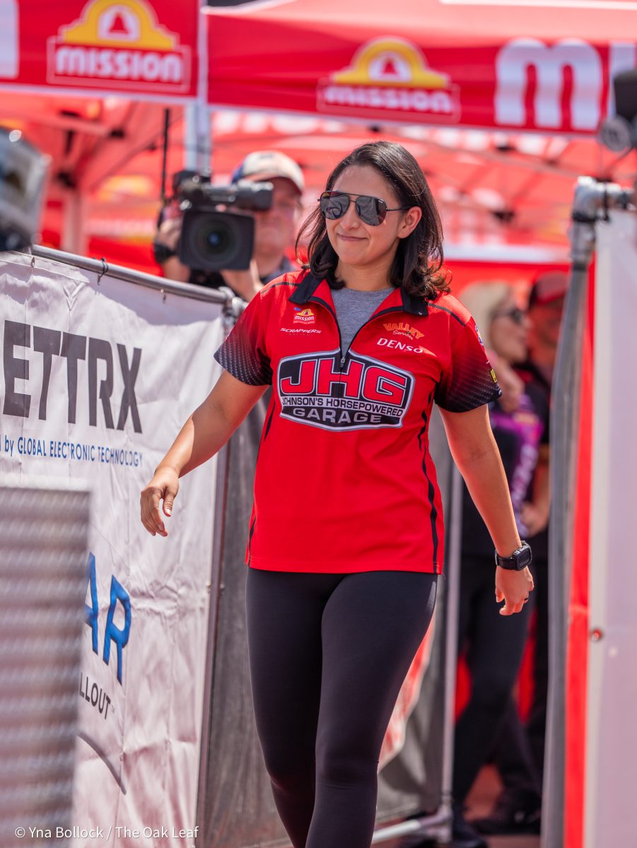 Pro Stock Motorcycle driver Jianna Evaristo walks out as Richard Gadson calls her out at the GETTRX All Start Pro Stock Motorcycle Callout at the DENSO NHRA Sonoma Nationals on Friday, July 25, 2025 in Sonoma.