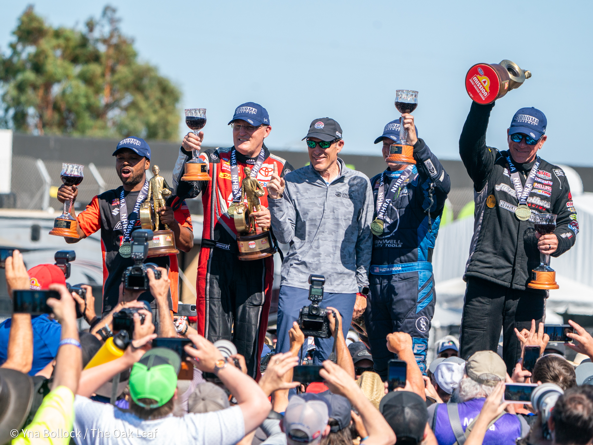 From left to right, Pro Stock Motorcycle winner Richard Gadson, Top Fuel winner Doug Kalitta, Exec. VP of Sonoma Raceway Brian Flynn, Funny Car winner Austin Prock and Pro Stock winner Greg Stansfield celebrate at the winner's circle on the final day of the DENSO NHRA Sonoma Nationals on Sunday, July 27, 2025 in Sonoma.