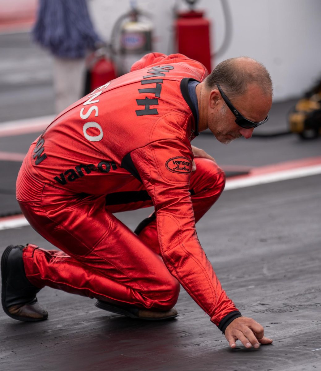 Pro Stock Motorcycle driver Matt Smith inspects the track conditions before his first GETTRK All Star Pro Stock Motorcycle Callout challenge at the DENSO NHRA Sonoma Nationals on Saturday, July 26, 2025 in Sonoma. 
