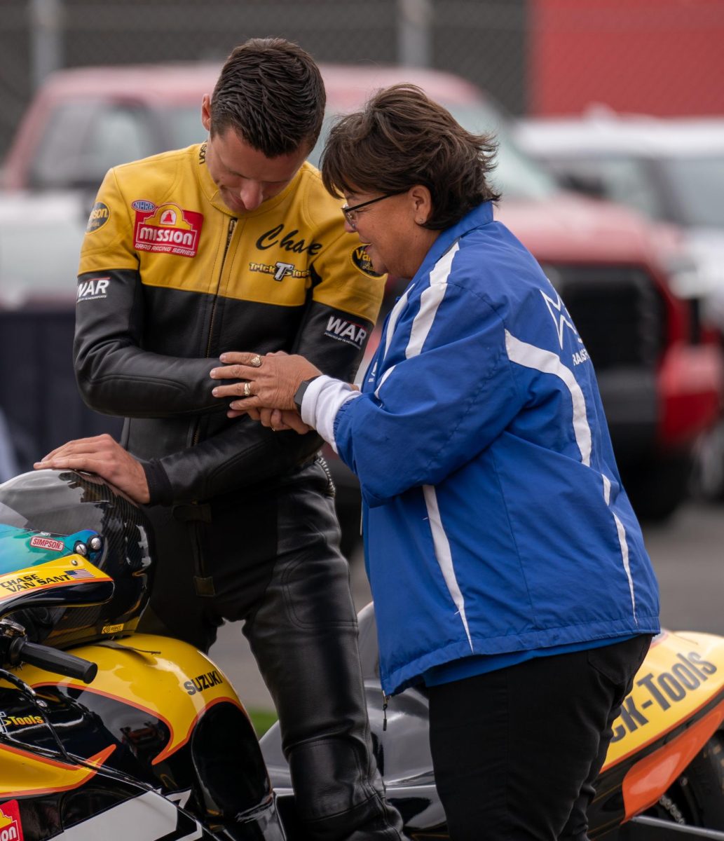 Pro Stock Motorcycle driver Chase Van Sant prays with a racetrack chaplin before his first GETTRK All Star Pro Stock Motorcycle Callout challenge run at the DENSO NHRA Sonoma Nationals on Saturday, July 26, 2025 in Sonoma. 