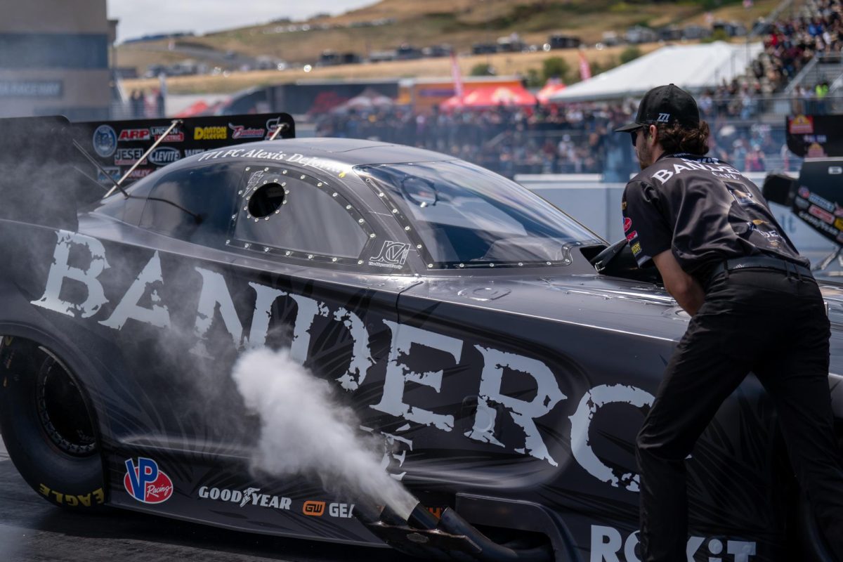 Funny Car driver Alexis Dejoria backs into her spot before her third run of qualifying at the DENSO NHRA Sonoma Nationals on Saturday, July 26, 2025 in Sonoma.