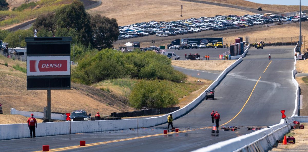 Buddy Hull's Funny Car explodes down the racetrack during round four of qualifying at the DENSO NHRA Sonoma Nationals on Saturday, July 26, 2025 in Sonoma. Hull hit the sand wall and safety nets, causing an hour and a half delay during the qualifying runs, He escaped the crash unharmed.