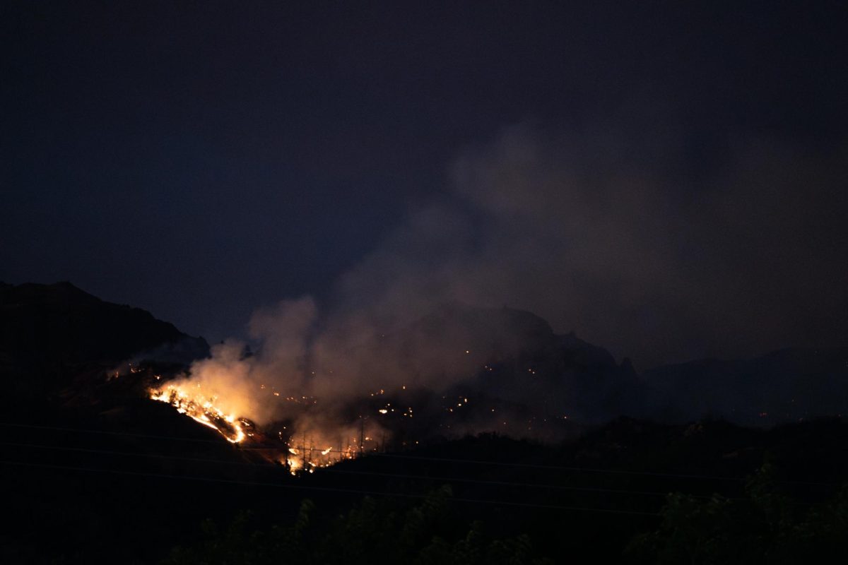 The Pickett fire continues to burn later into the night at 7:23 p.m. on Thursday, Aug. 21, 2025.