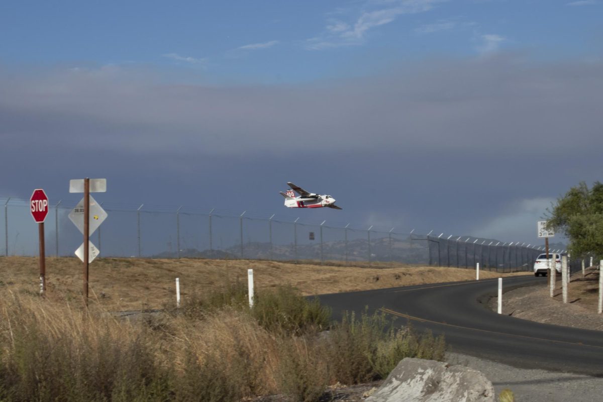 A Cal Fire bomber carrying fire retardant takes off from Charles M. Schulz Sonoma County Airport to provide aerial support for the Pickett Fire near Calistoga, Calif. on on Thursday, Aug. 21, 2025.