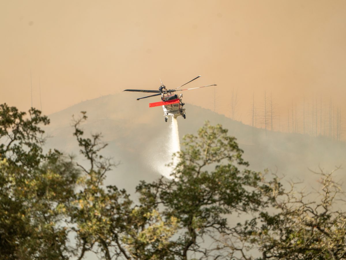 Cal Fire helicopters dump water on the Pickett Fire near Calistoga, Calif. on Thursday, Aug. 21, 2025.