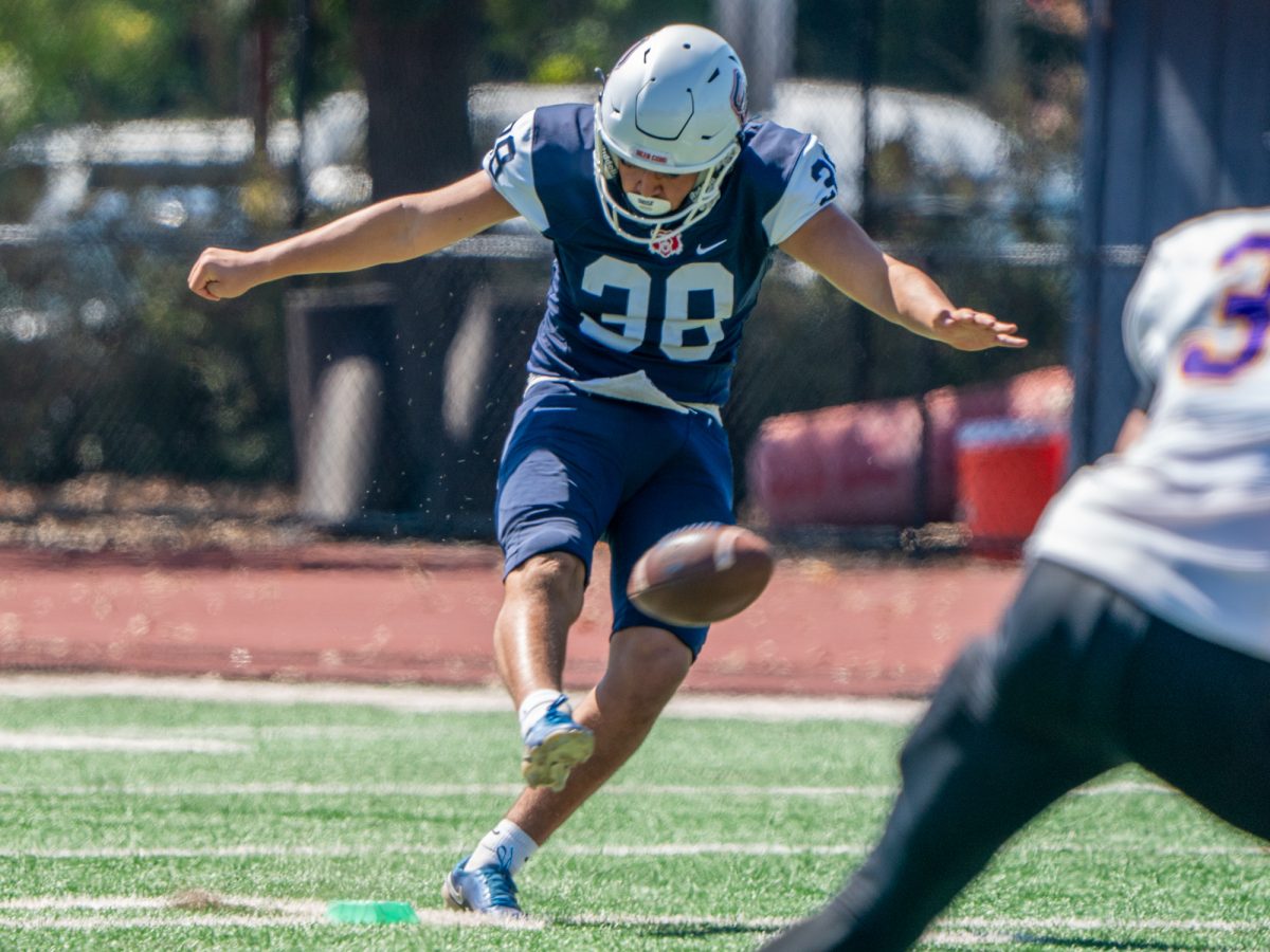 SRJC kicker Anthony Calvillo sends the ball flying with a 65-yard kickoff for a touchback in the first quarter against San Jose City College on Saturday, Sept. 20 at home.