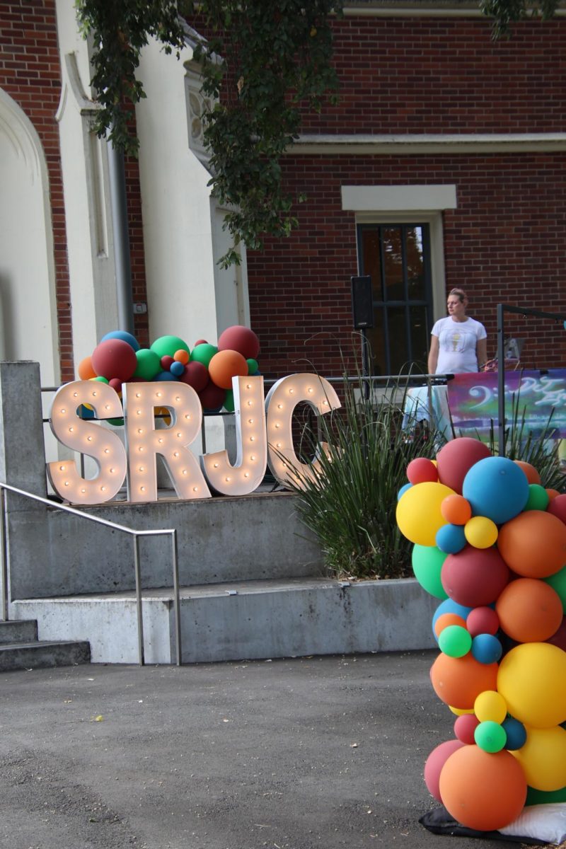 Balloons, music, and glowing marquee letters greet attendees of the president's address at Santa Rosa Junior College's Burbank Auditorium on Sept. 18, 2025.