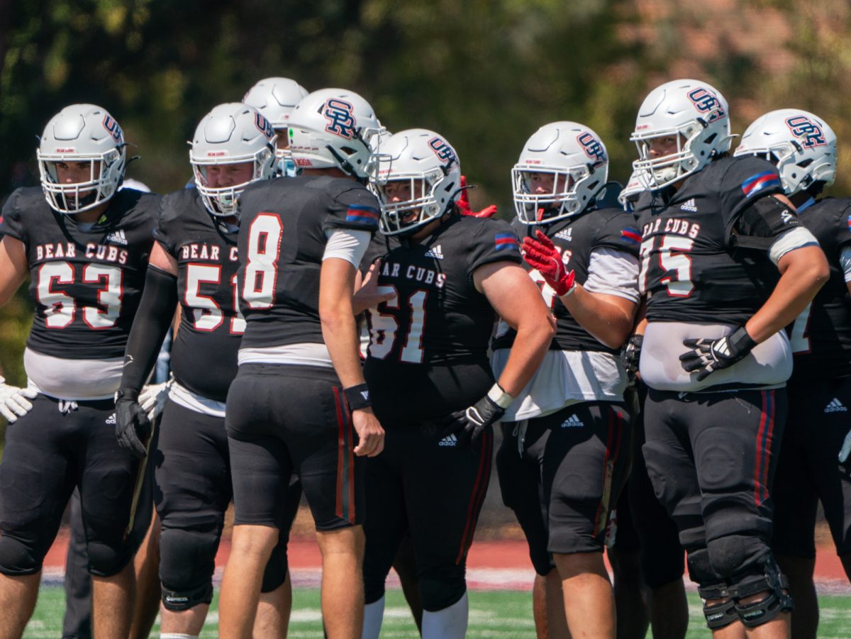 Quarterback Jacob Porteous and the Bear Cubs offense huddle during the game against Modesto Junior College on Saturday, Sept. 6, 2025 in Santa Rosa.