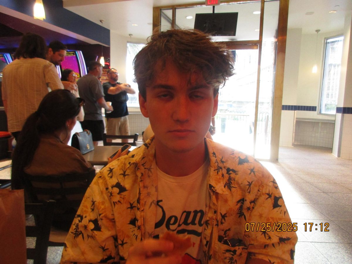 Oak Leaf Reporter Archie Henderson suffers the consequences of consuming eight White Castle sliders in one sitting at 5:12 p.m. July 25 at the White Castle in Las Vegas, Nevada.