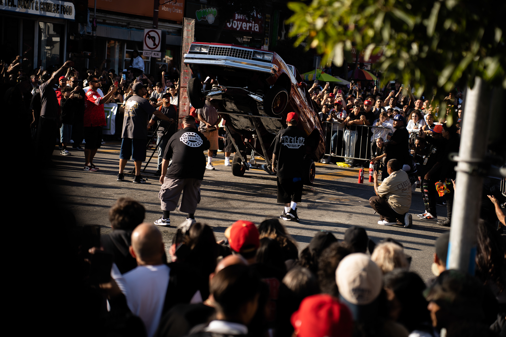 Car parts flying and bumpers smashing as hydraulic wizards push their lowriders over the limit to compete in the Thrill of the Hop competition, during the King of the Streets lowrider parade on 24th and Mission streets in San Francisco on Saturday, Sept. 20, 2025.