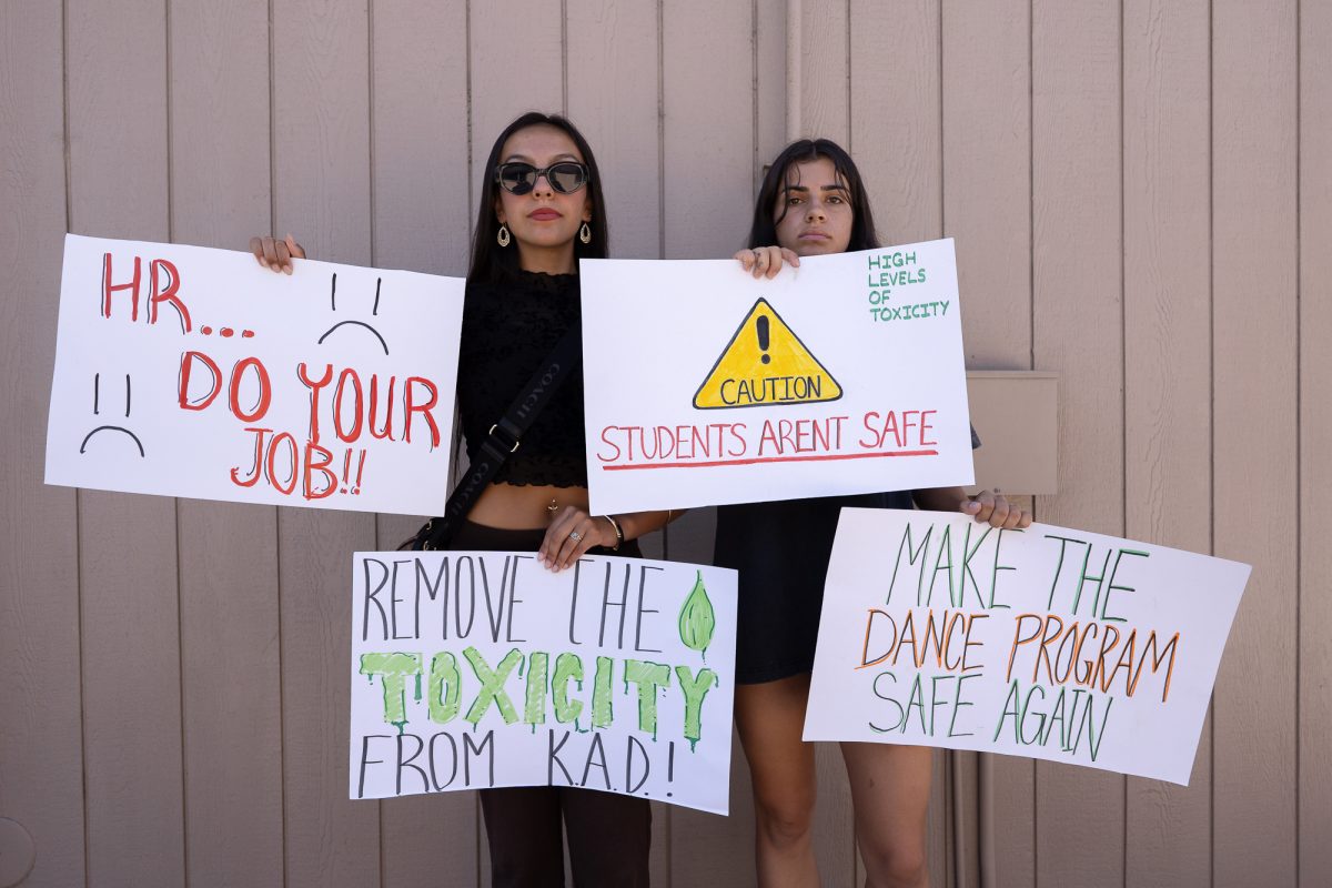 Jordan Isabella Tauzer-Pardo, left, and Genevieve Mychajluk, right, picket outside of the dance studio in Analy Village at Santa Rosa Junior College on Wednesday, Sept. 3, 2025.