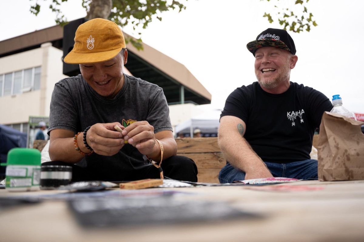 Ninj, left, and Damien Moore, right, hangout at the consumption area at Hall of Flowers in the Santa Rosa Fairgrounds on Wednesday, Sept. 10, 2025.