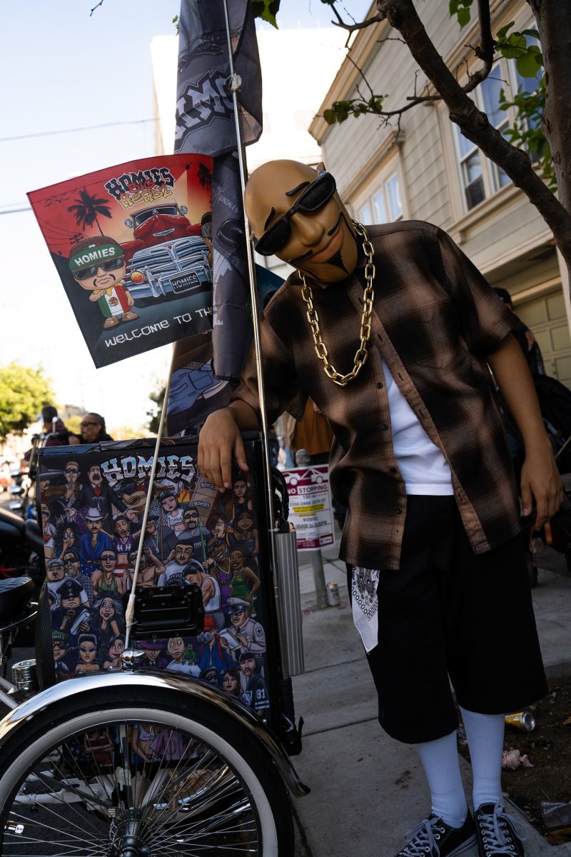 A San Jose Homies member dressed as Pelon from David Gonzales' famous figurine collection, during the King of the Streets lowrider parade on Mission Street in San Francisco on Saturday, Sept. 20, 2025.
