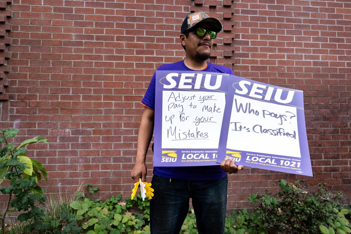 Diego Osorio, with the Service Employees International Union, pickets outside of the President's Address at Santa Rosa Junior College's Burbank Auditorium on Thursday, Sept. 18, 2025. "Right now, the lowest paid employee on the classified will be actually gaining a net-negative on their increase, because with the premium--- at least for the family plan --- it will erase the increase of their salary," Osorio said. 