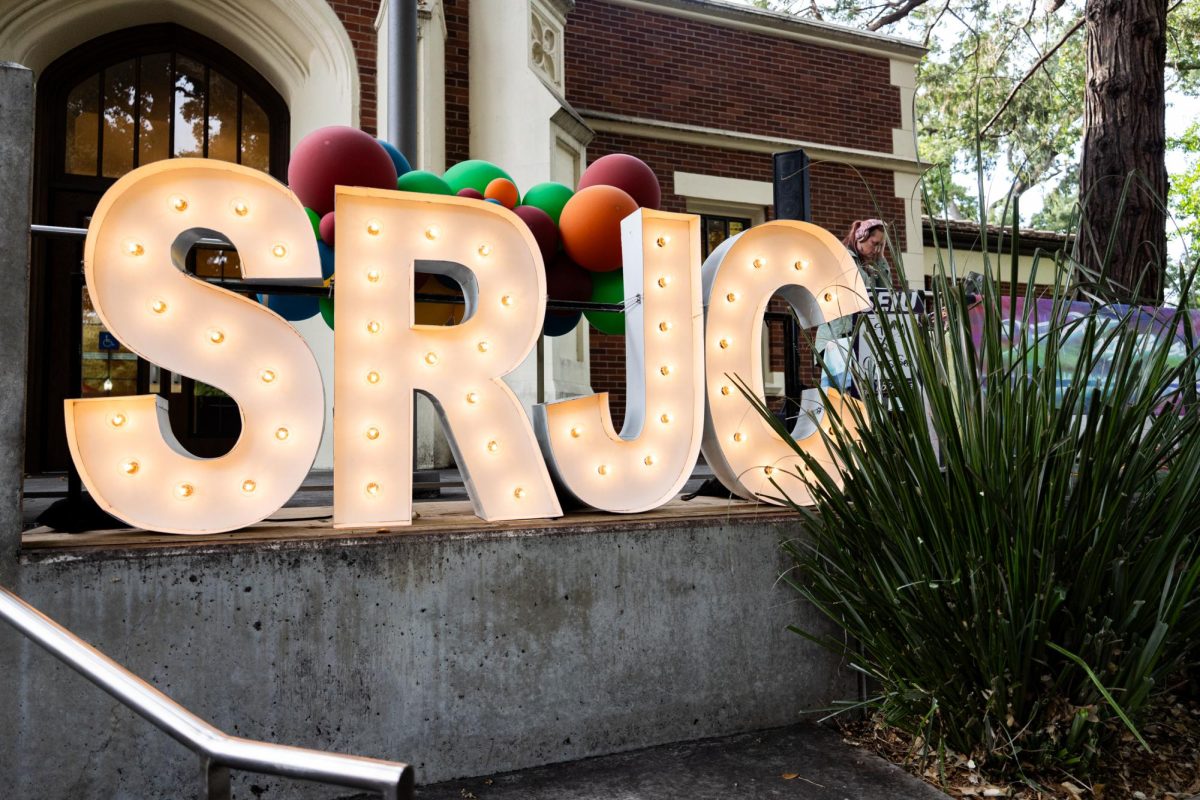 Alpha-lit marquee letters spelling 'SRJC' decorate the front of Burbank Auditorium for the President's Address on Thursday, Sept. 18 in Santa Rosa.