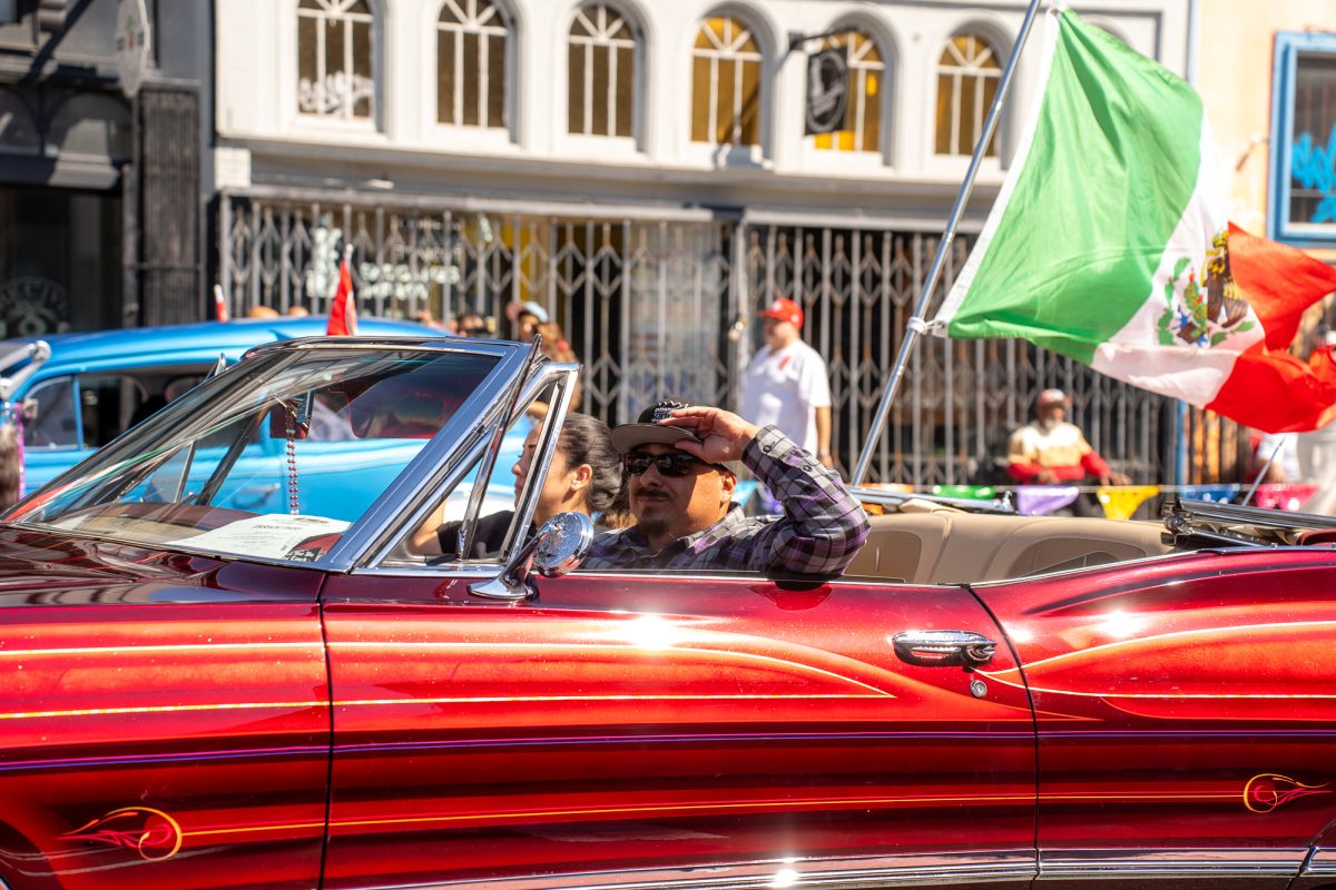 A lowrider sparkled under the suns beaming rays, showing the unique paint jobs that typically decorate lowriders, during the King of the Streets lowrider parade on 24th and Mission streets in San Francisco on Saturday, Sept. 20, 2025.