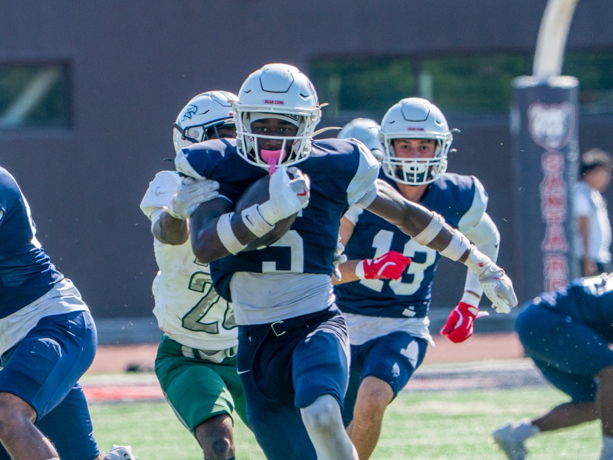 Defensive back Khai Dukes speeds away from Laney's defensive hands during the game on Saturday, Sept. 27 at home.