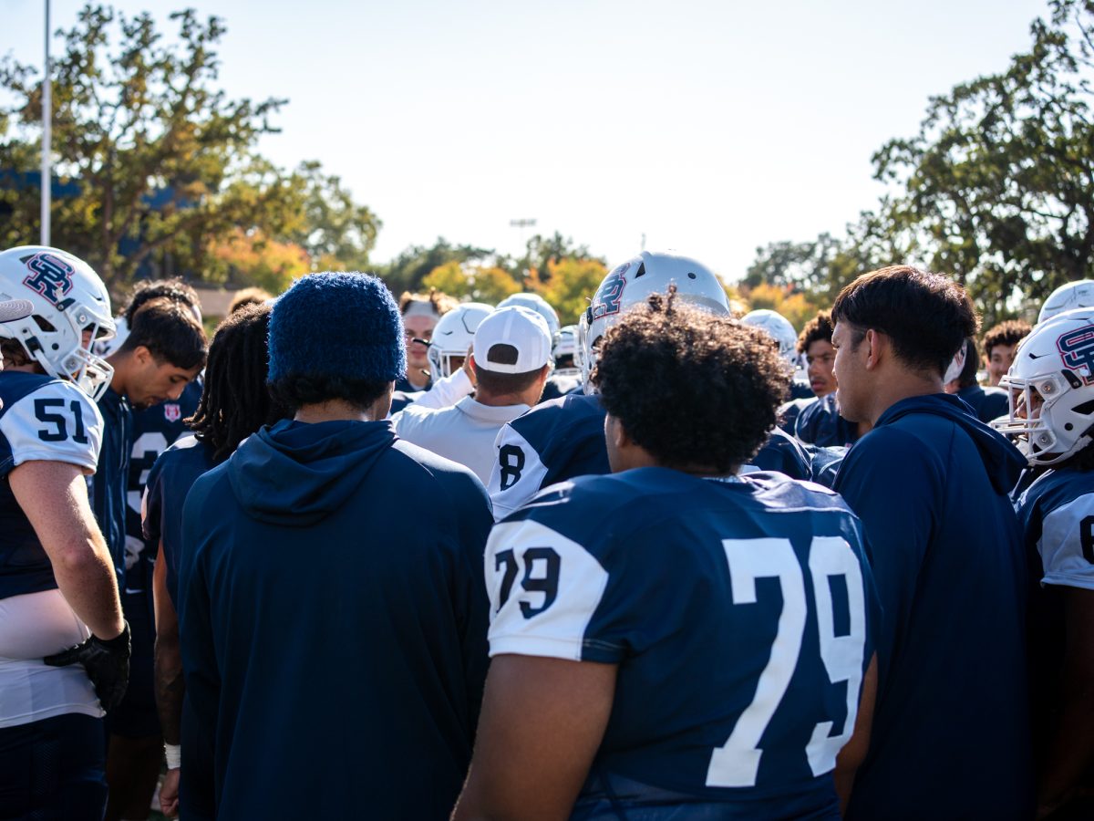 The SRJC football team huddles near the end zone after taking the win against Laney College on Saturday, Sept. 27 at home.