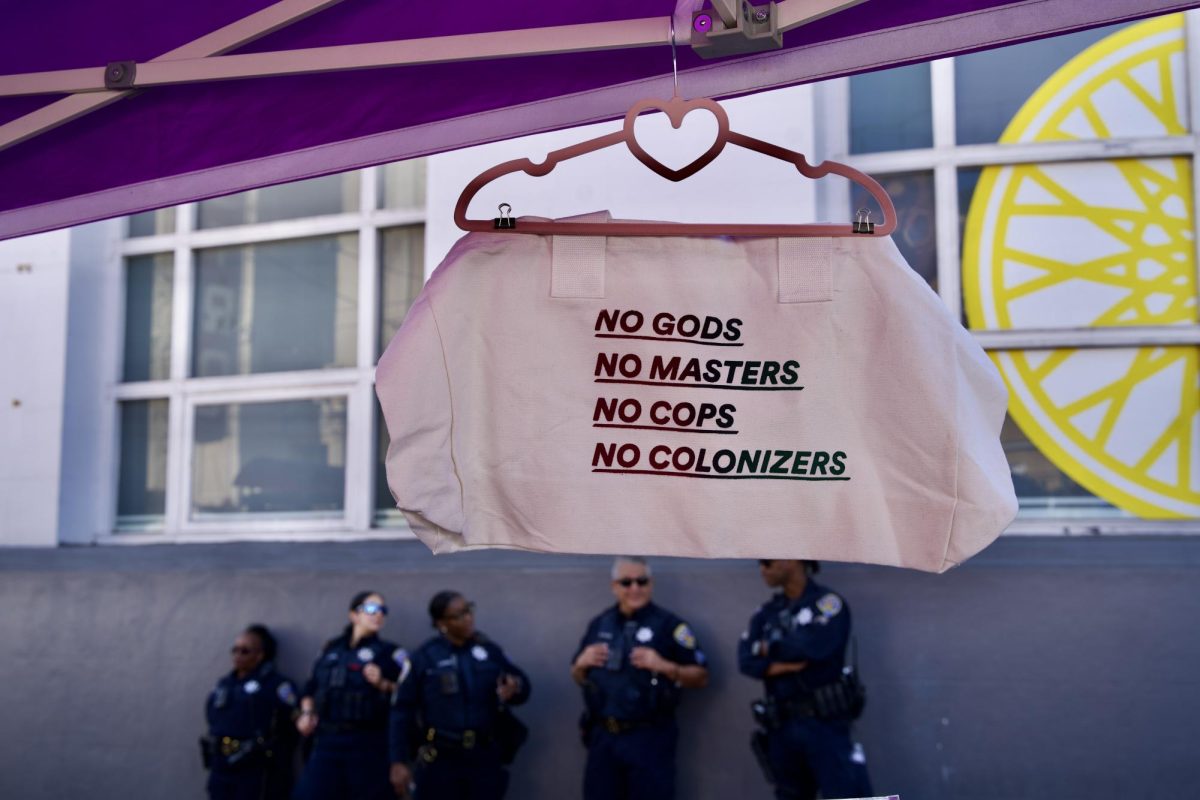 A day before the 36th anniversary of the Castro Sweep — a violent police riot against queer community members and ACT UP protestors — SFPD officers fraternize at the Castro Street Fair on Sunday Oct. 5, 2025. 