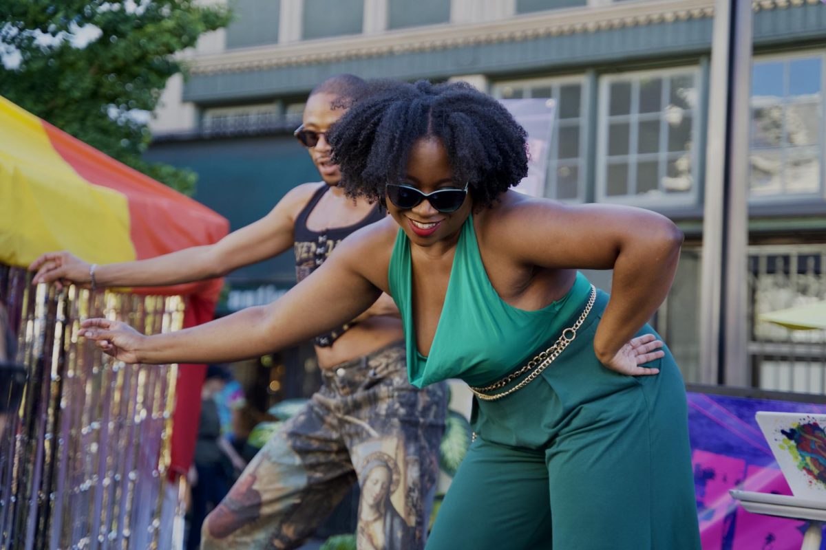 Jean Omen (left) and G-Funk (right) unintentionally synchronize their dance moves while performing on the Queer AF Stage at the Castro Street Fair on Sunday Oct. 5, 2025.